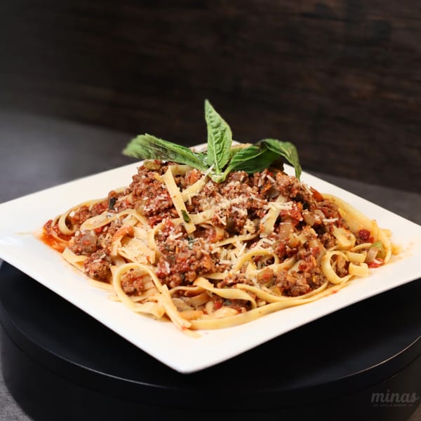 Minas Grill & Market's fettuccine pasta with bolognese sauce, parmesan cheese, and fresh basil.